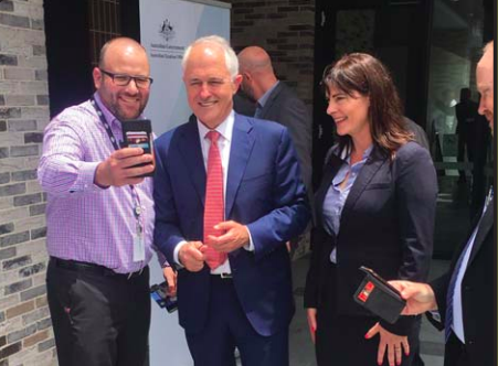 delivered relief income workers tax government minister ato turnbull lucy employee robertson wicks pose prime ms photograph member