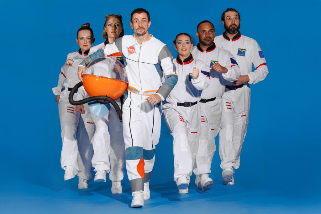 Hero's outer space journey in comical circus spectacle